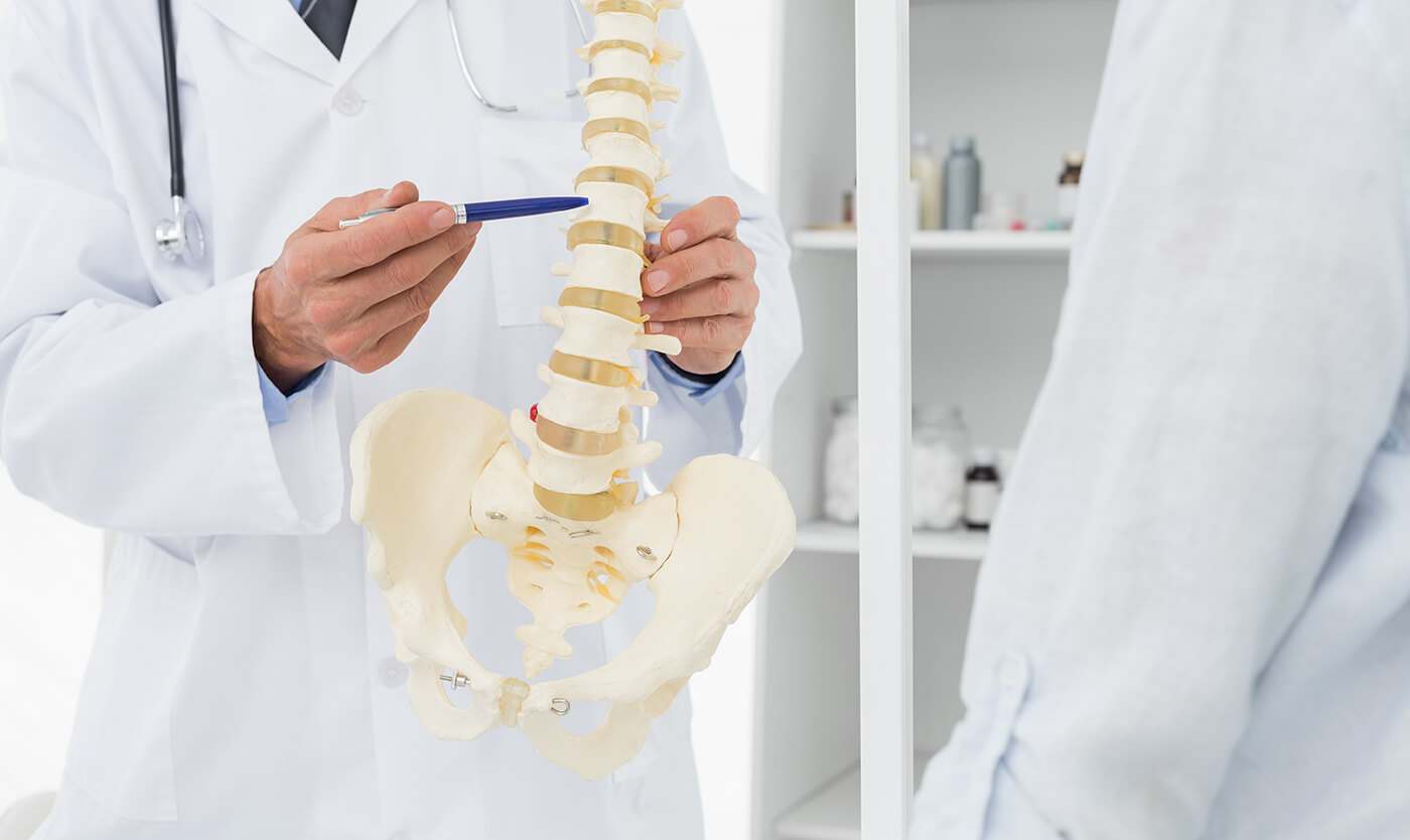 Chiropractor talking to a patient about herniated discs